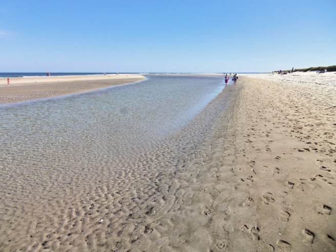 Washboarding and footprints decorate the sand at Crane Beach.