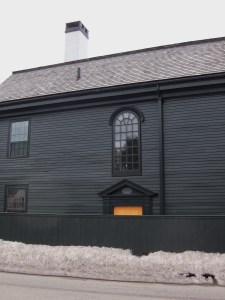 A Palladian window stands over the doorway. 