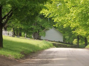 The road approaches the old schoolhouse.