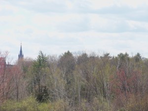 Seen from the falls, Ste. Marie Roman Catholic church crowns Manchester's French-Canadian West Side.