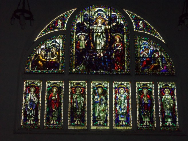 The south wall of the sanctuary is dominated by this traditional design, which includes a row of named angels along the bottom.