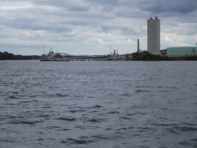 Clouds and a sharp breeze arrived quickly after we left the dock and started passing industrial waterfront. 